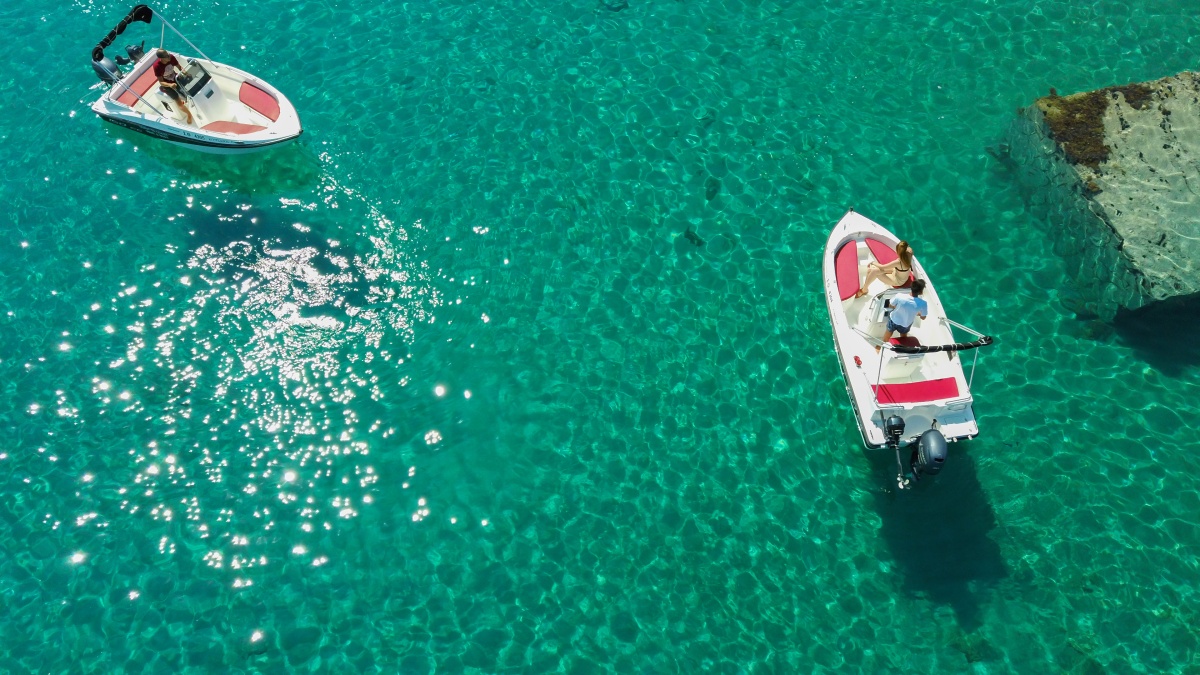 aerial-shot-of-people-driving-motorboats-on-a-transparent-sea.jpg aerial-shot-of-people-driving-motorboats-on-a-transparent-sea.jpg